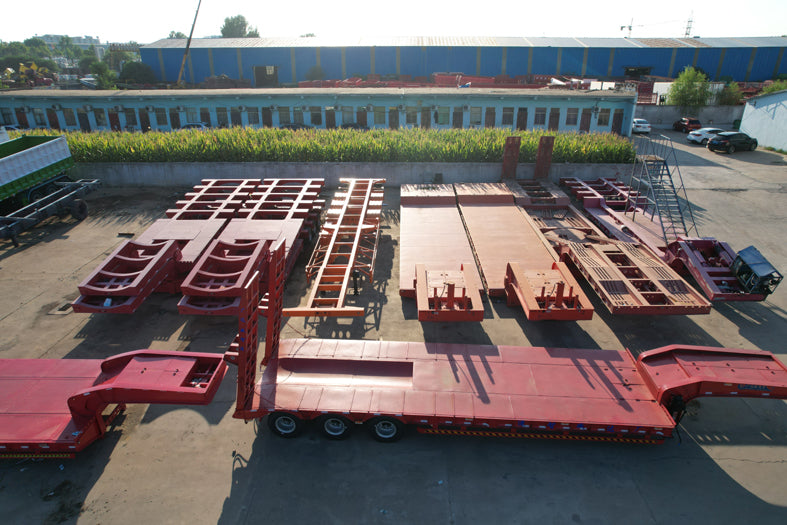 Heavy duty low flatbed transport semi-trailer