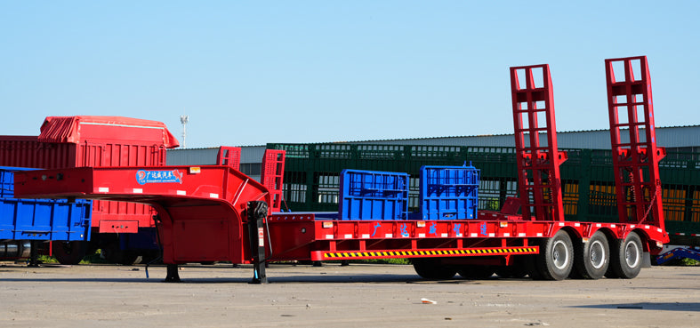 Heavy duty low flatbed transport semi-trailer
