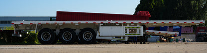 Heavy duty flatbed transport semi-trailer